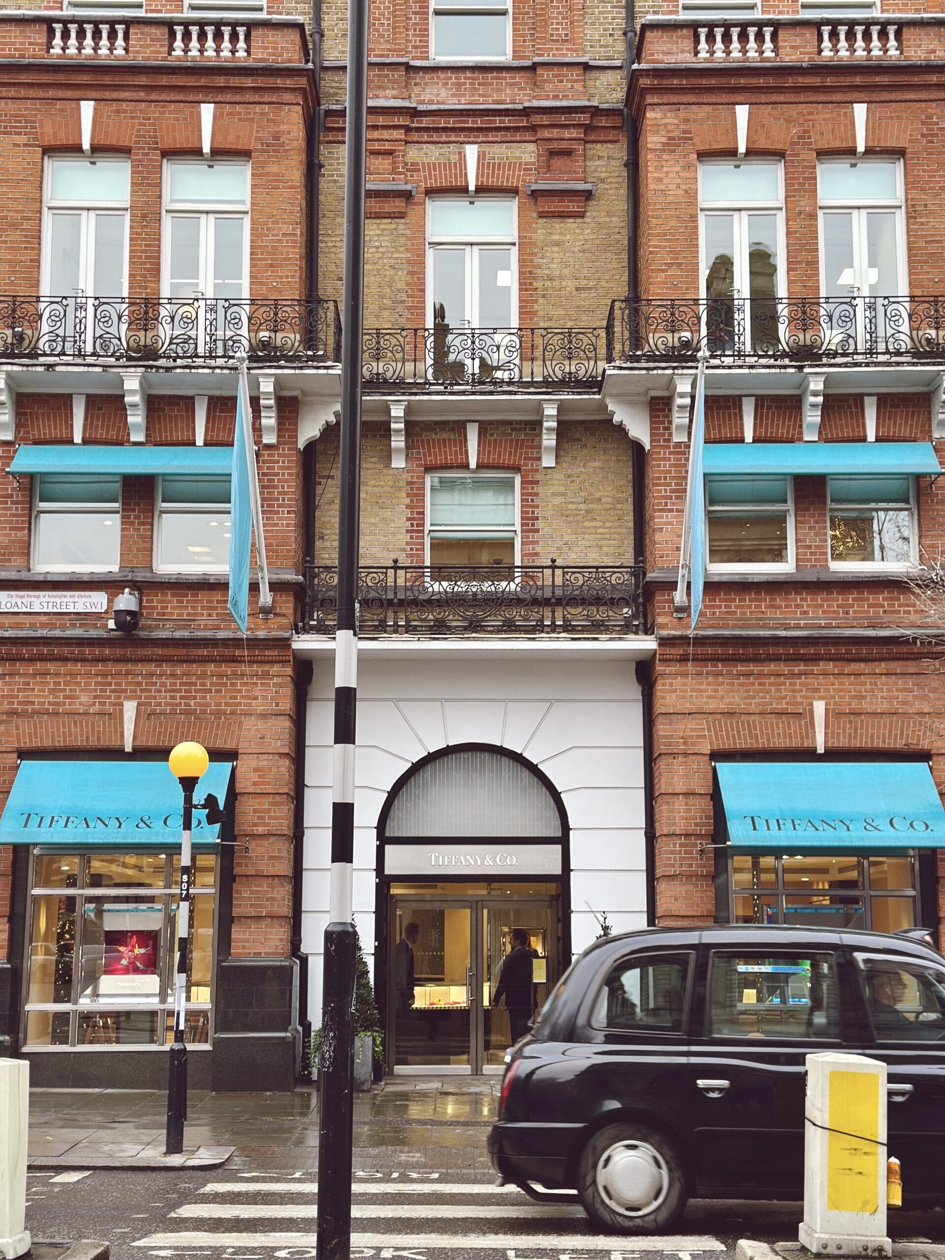 Tiffany and Co Old Bond Street store in London outside - classic brick building with torquoise accents