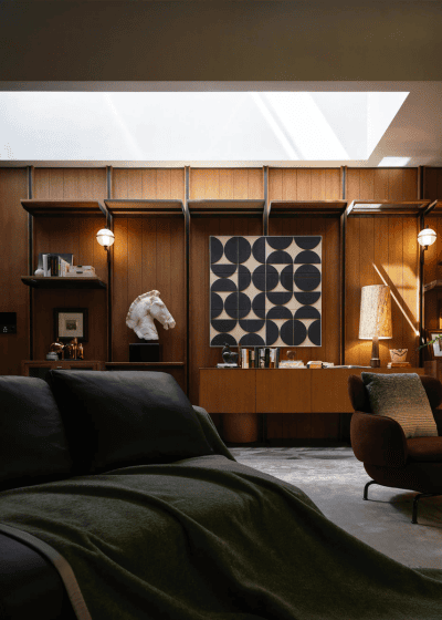 Classic interior design stylish wooden panel walls and modern bauhaus style art, black sofa