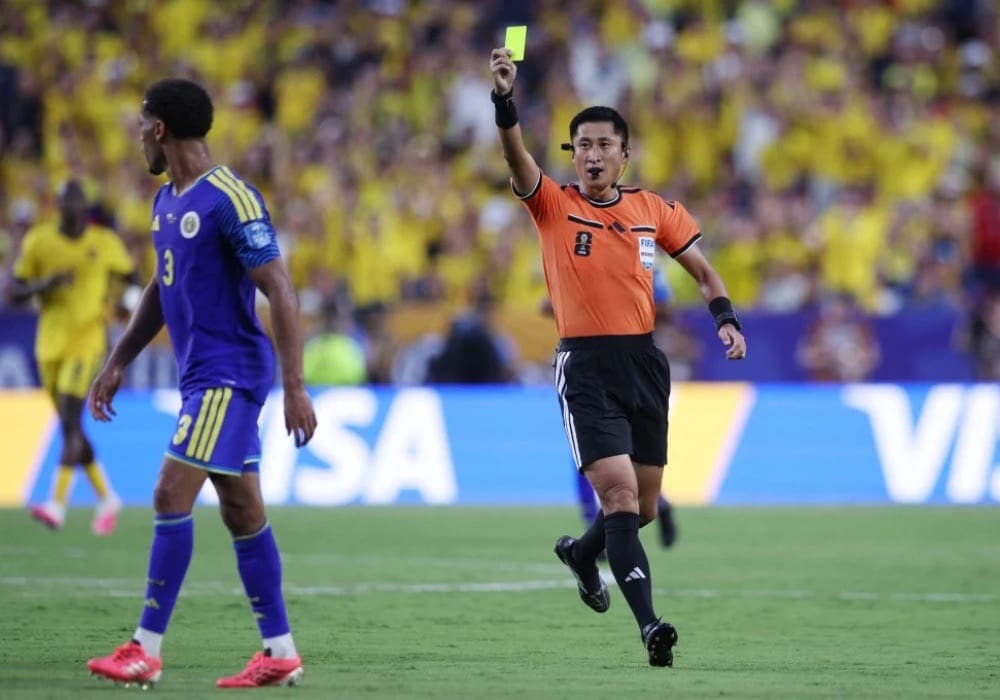 Ma ning referee running and showing yellow card at world cup 2026