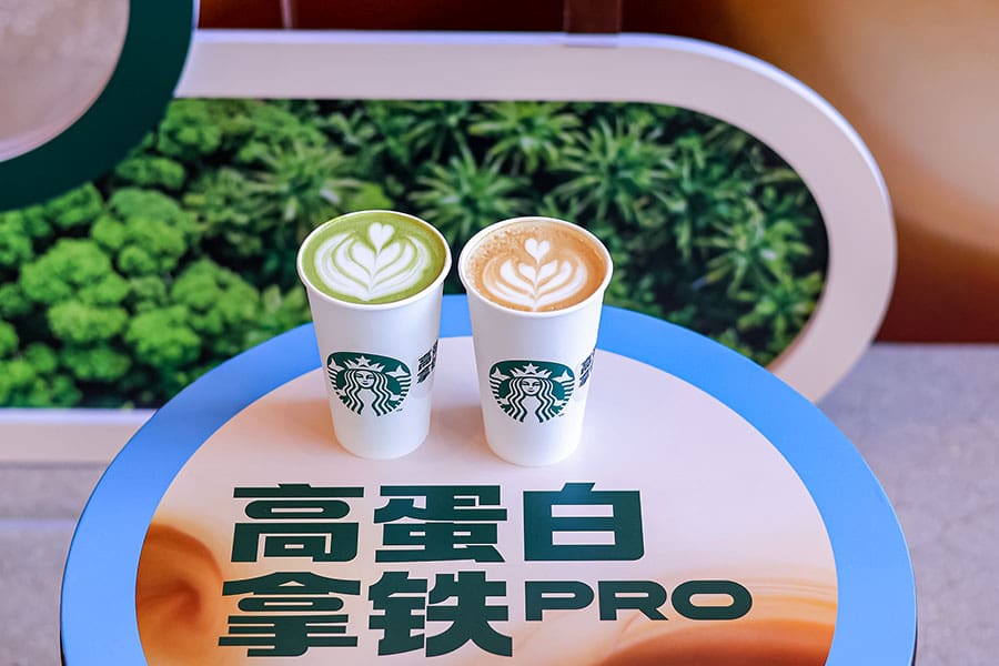 Two cups of protein Starbucks coffee and matcha on a table in China